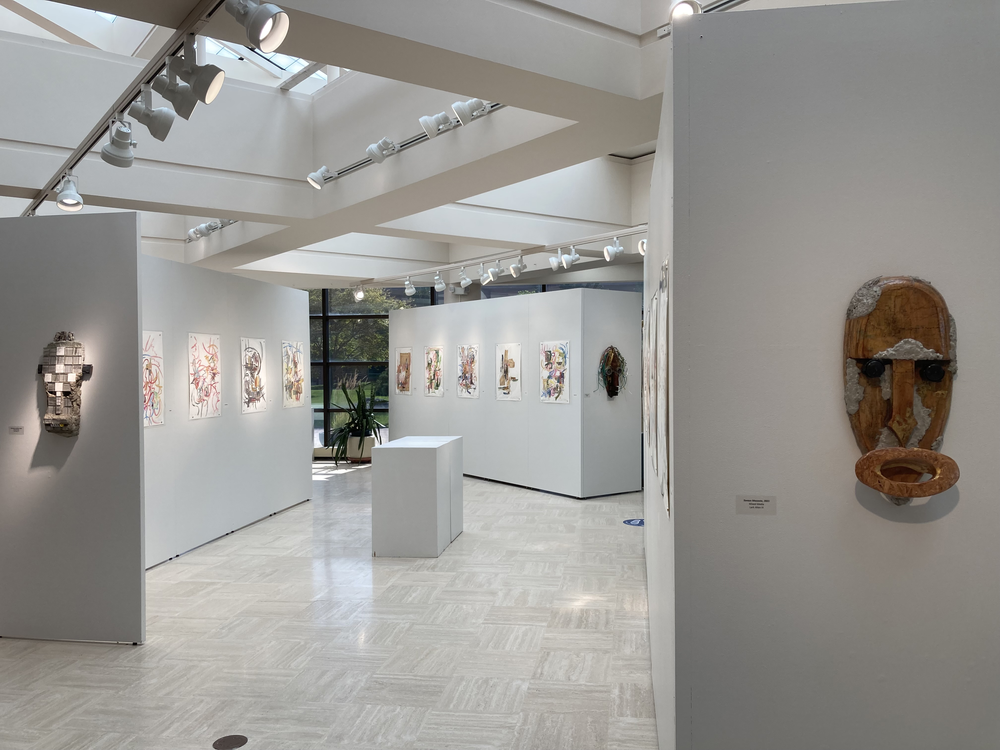 Beck exhibition from the north end looking south Allen masks in foreground paintings in background